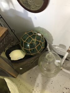 A glass sphere covered in rope net