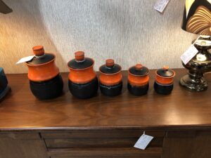Black and orange ceramic pots