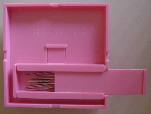 Underside of the Hazel's Adjust-o-Peg loom, showing the small box for holding the pins.
