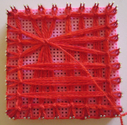 Weaving tied lace in progress.