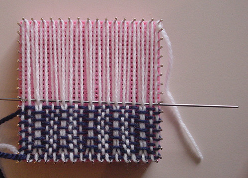 Weaving a design on the adjust-o-peg loom with different coloured warp and weft.