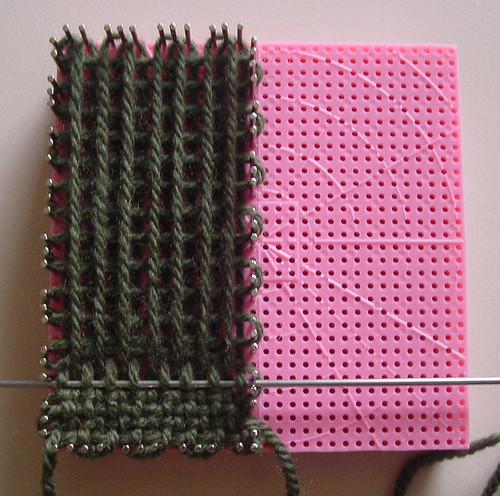 Weaving a rectangle on one half of the loom, using the three pin continuous method.