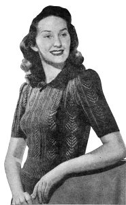 A short sleeved women's pullover with puffed, short sleeves and diamond lace pattern.