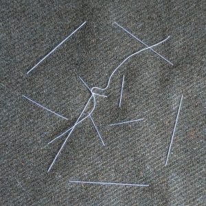 Large stitches on the back of the fabric.