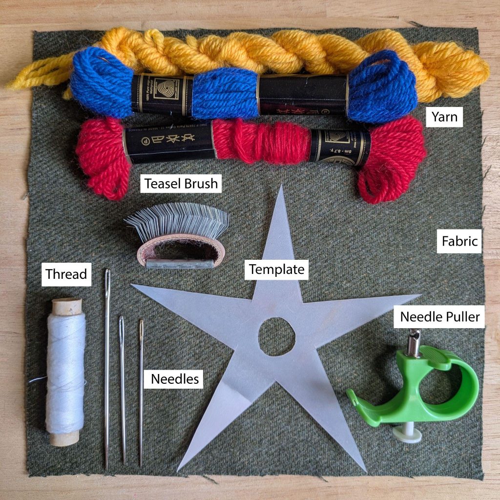 A photo of the tools and materials for working this motif. Yarn, a square of wool fabric, teasel brush, template, basting thread, sewing needles, template and needle puller.