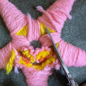 Cutting the layers of stitching in the centre of the star.