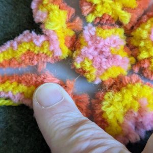 A close up of the cut stitching, showing that there are still some threads uncut.