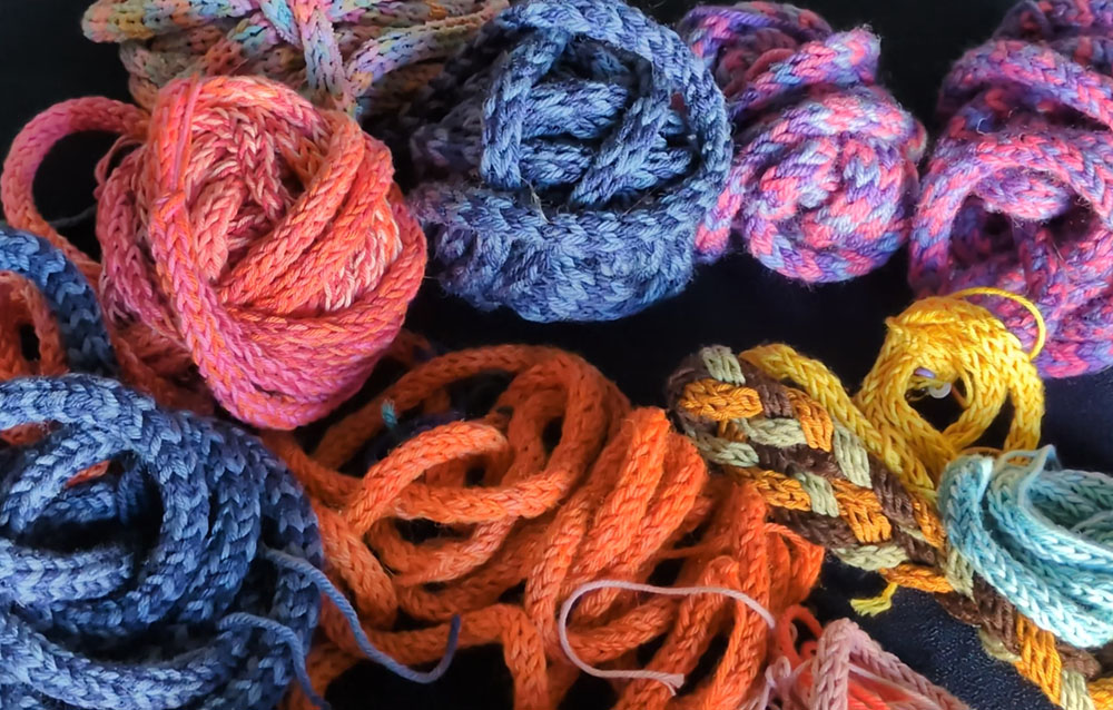 A pile of different coloured knit i-cords